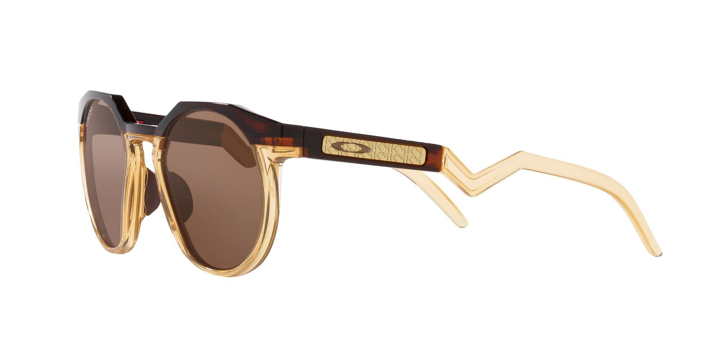 Oakley Men's OO9242 HSTN Round Sunglasses, Kylian Mbappe Dark Amber/Light Curry/Prizm Tungsten, 52 mm