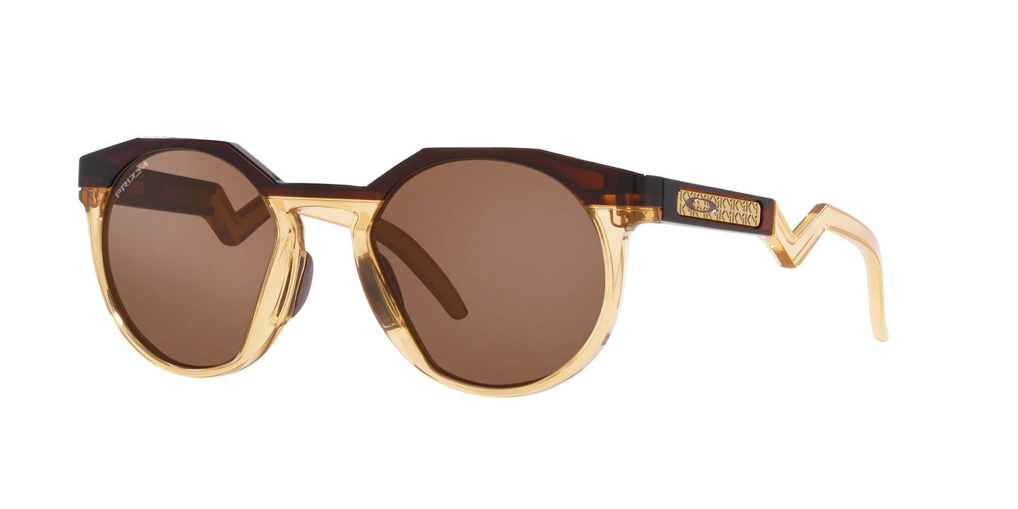 Oakley Men's OO9242 HSTN Round Sunglasses, Kylian Mbappe Dark Amber/Light Curry/Prizm Tungsten, 52 mm