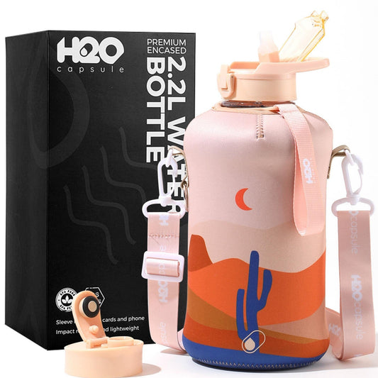 H2O Capsule 2.2L Half Gallon Water Bottle with Storage Sleeve and Covered Straw Lid – BPA Free Large Reusable Drink Container with Handle - Big Sports Jug, 2.2 Liter (74 Ounce), Desert Night