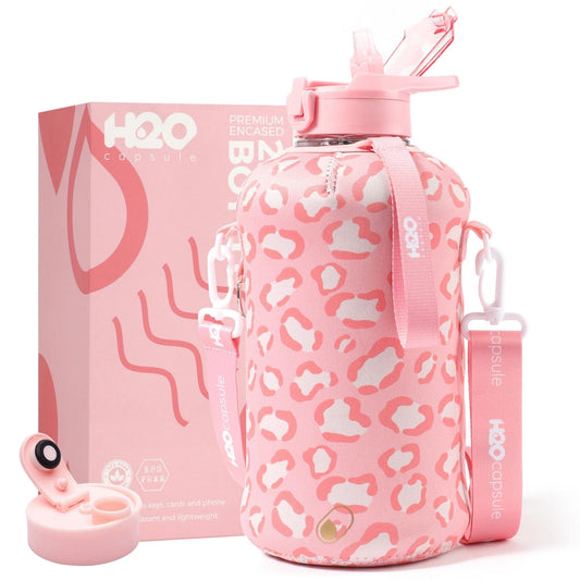 H2O Capsule 2.2L Half Gallon Water Bottle with Storage Sleeve and Covered Straw Lid – BPA Free Large Reusable Drink Container with Handle - Big Sports Jug, 2.2 Liter (74 Ounce) Pink Leopard