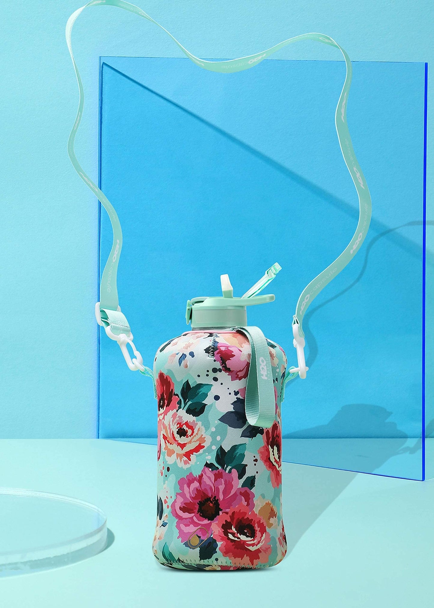 H2O Capsule 2.2L Half Gallon Water Bottle with Storage Sleeve and Covered Straw Lid – BPA Free Large Reusable Drink Container with Handle - Big Sports Jug, 2.2 Liter (74 Ounce) Floral Bloom