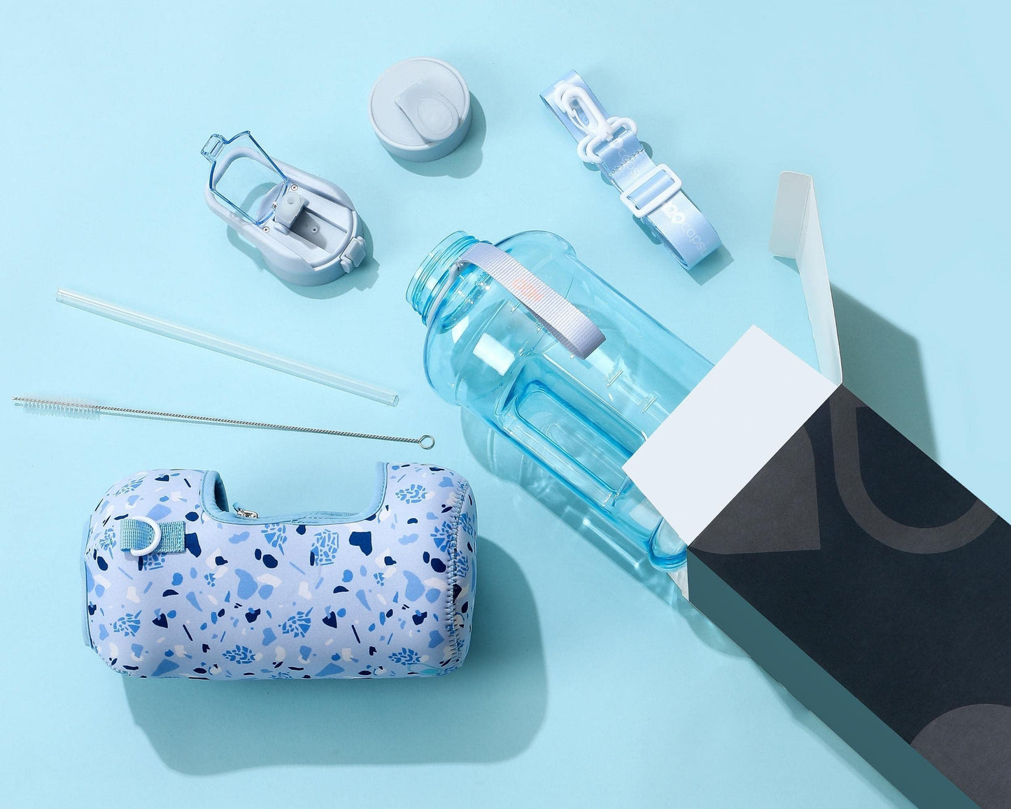 H2O Capsule 2.2L Half Gallon Water Bottle with Storage Sleeve and straw lid– BPA Free Large Water Bottle/2.2 Liter (74 Ounce) Big Sports Bottle Jug with Handle (Blue Pebbles)