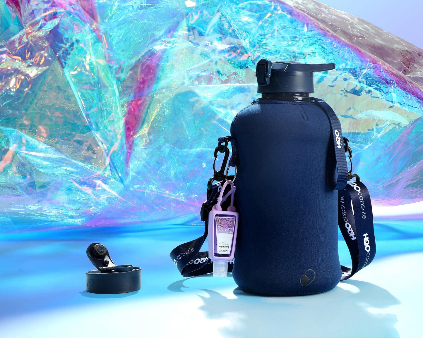 H2O Capsule 2.2L Half Gallon Water Bottle with Storage Sleeve and Covered Straw Lid – BPA Free Large Reusable Drink Container with Handle - Big Sports Jug, 2.2 Liter (74 Ounce) Navy Blue